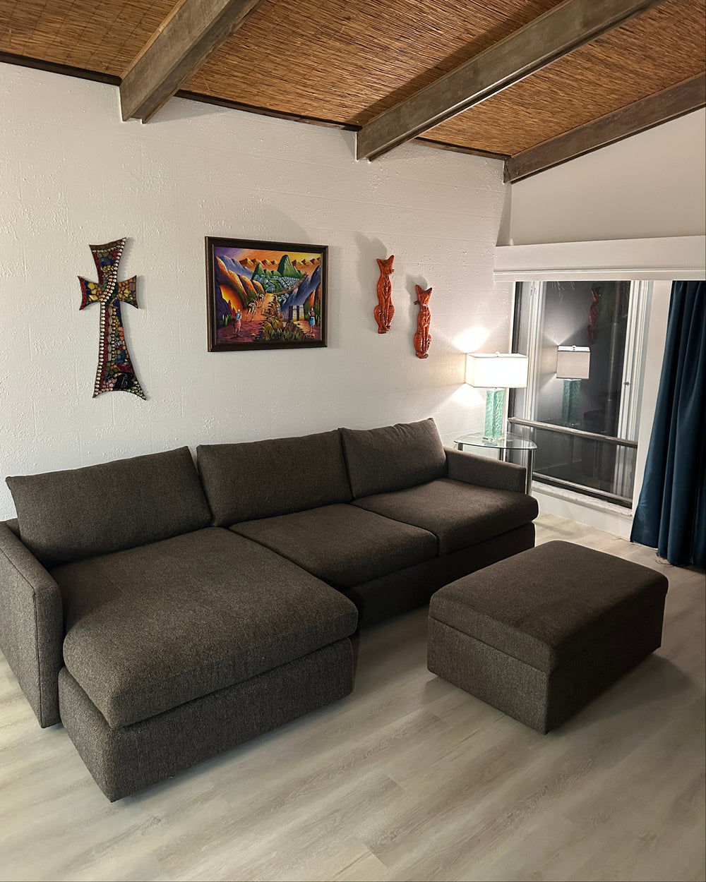Brown sectional with ottoman in a Palm Beach home