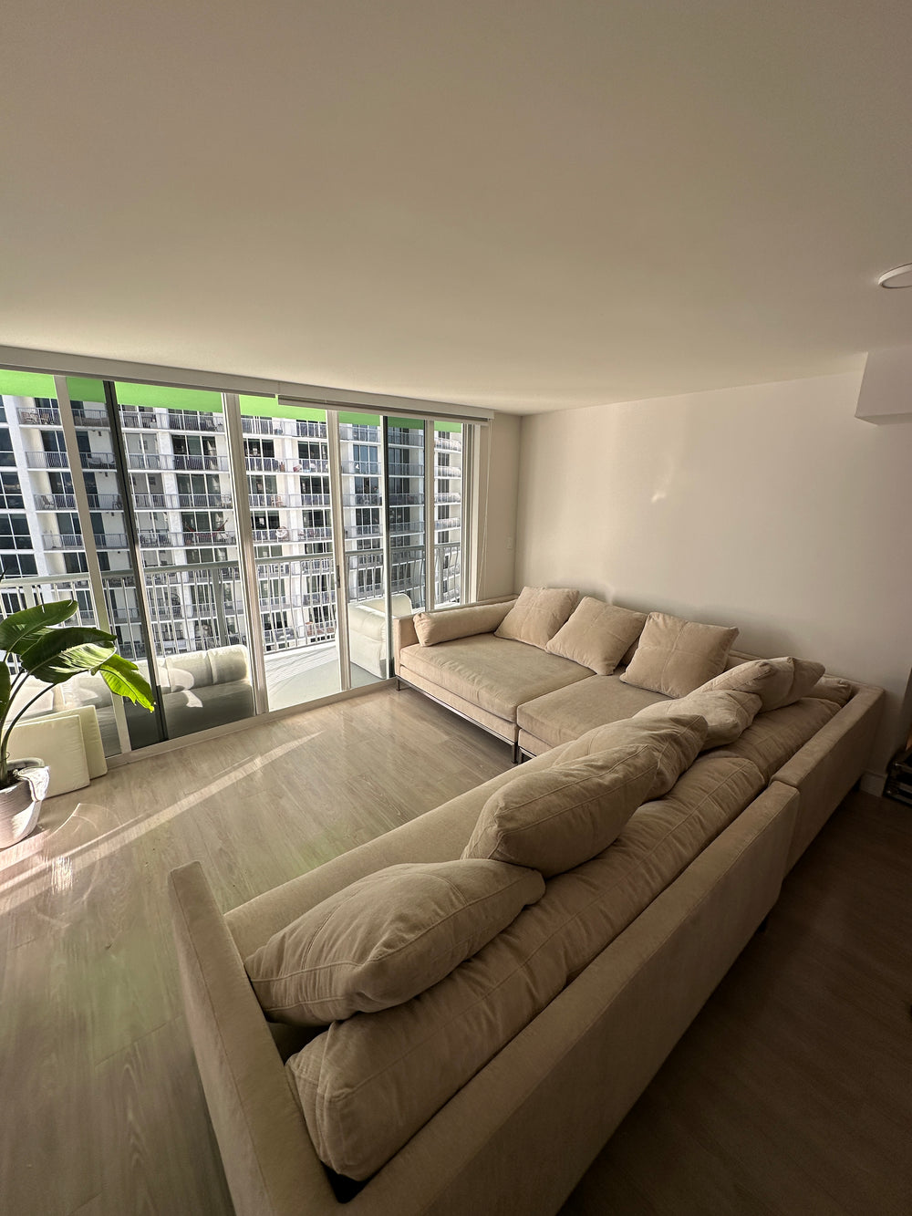 Cream sectional in a waterfront condo
